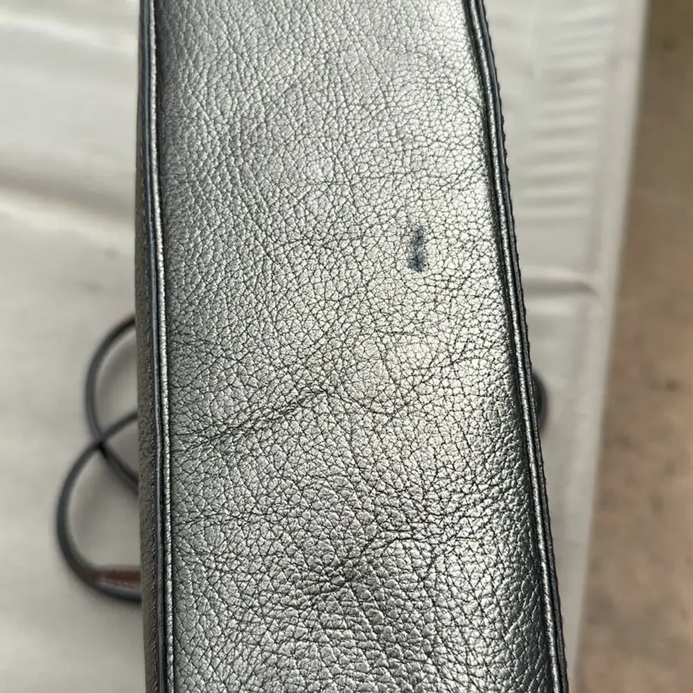 Elegant Coach Metallic Tote Bag with brown leather handles. Pre-loved.